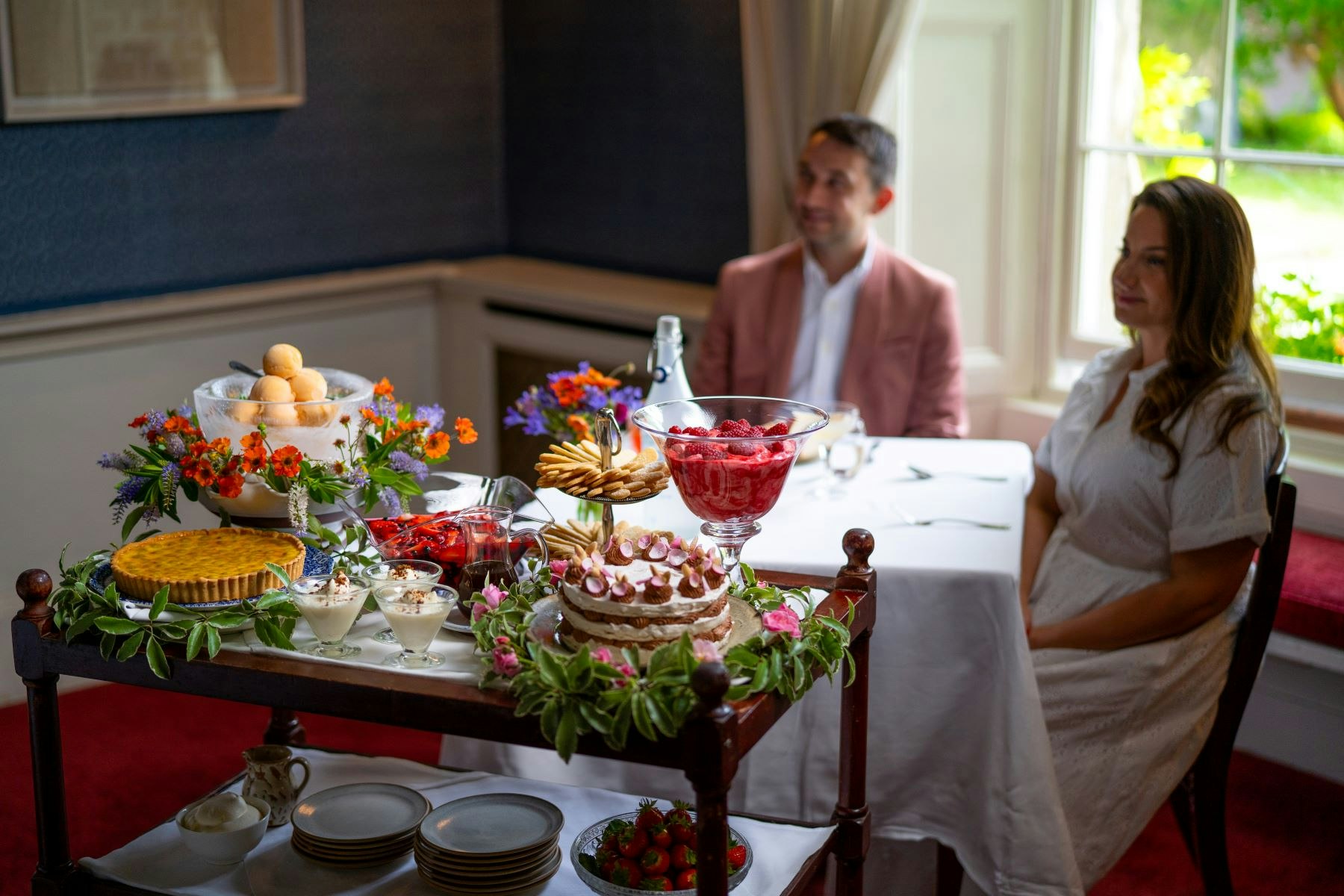 Couple Enjoying Dessert Trolley