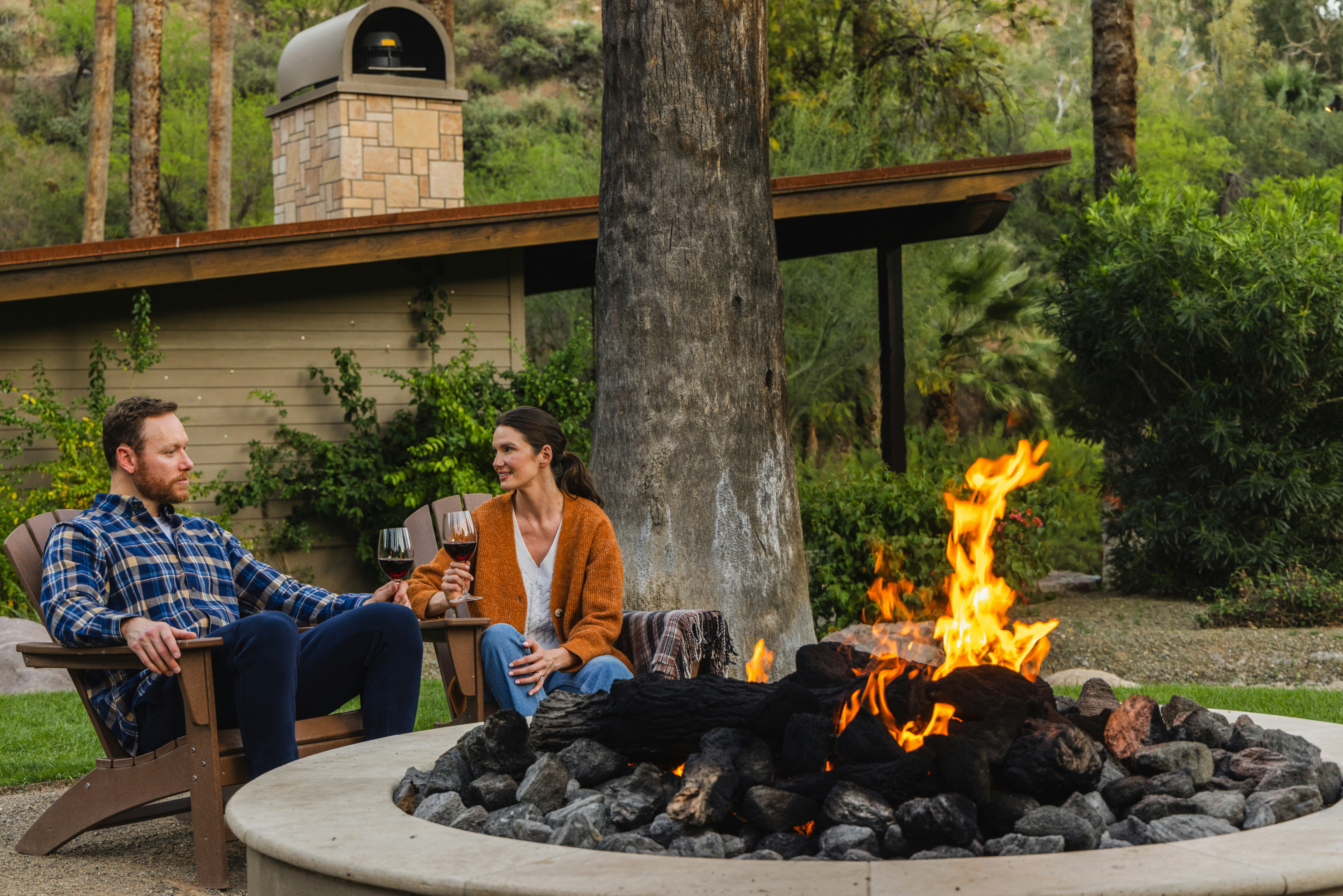 Couple Drinking Wine by a Firepit Castle Hot Springs