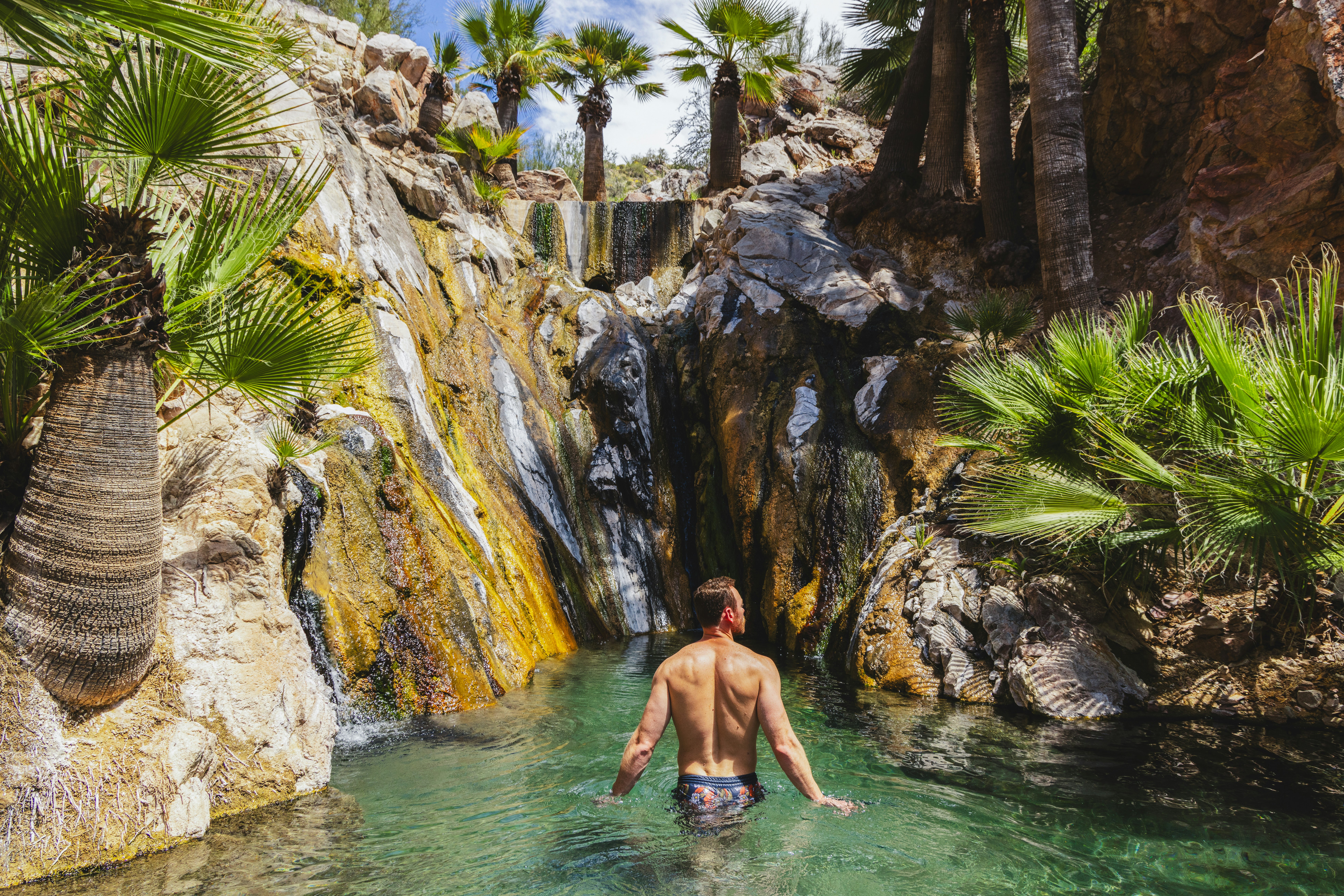 Man enjoying the hot springs pool at Castle Hot Springs