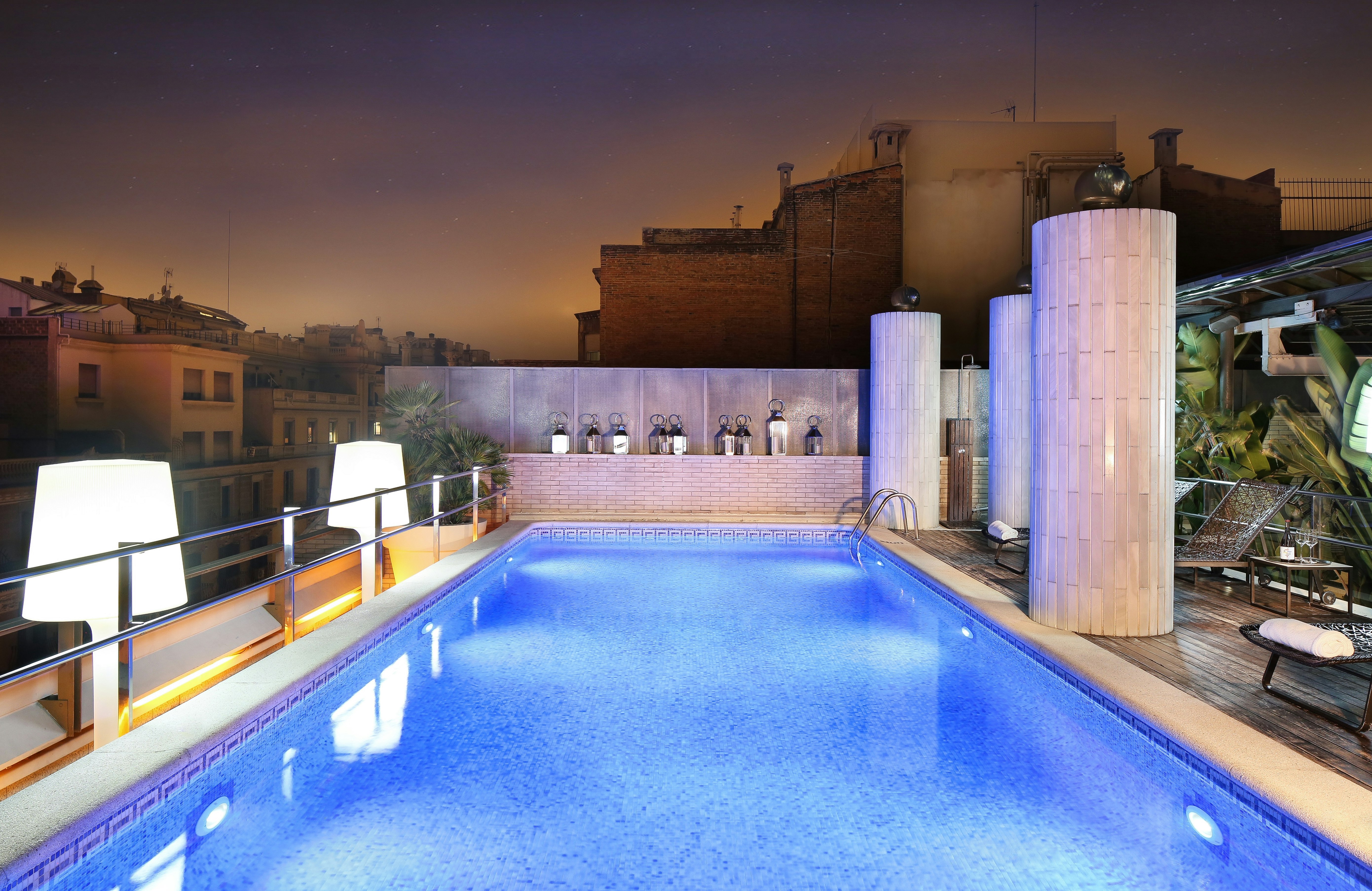 Swimming pool in rooftop terrace at night