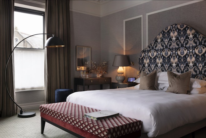 Signature Deluxe Room - Bedroom