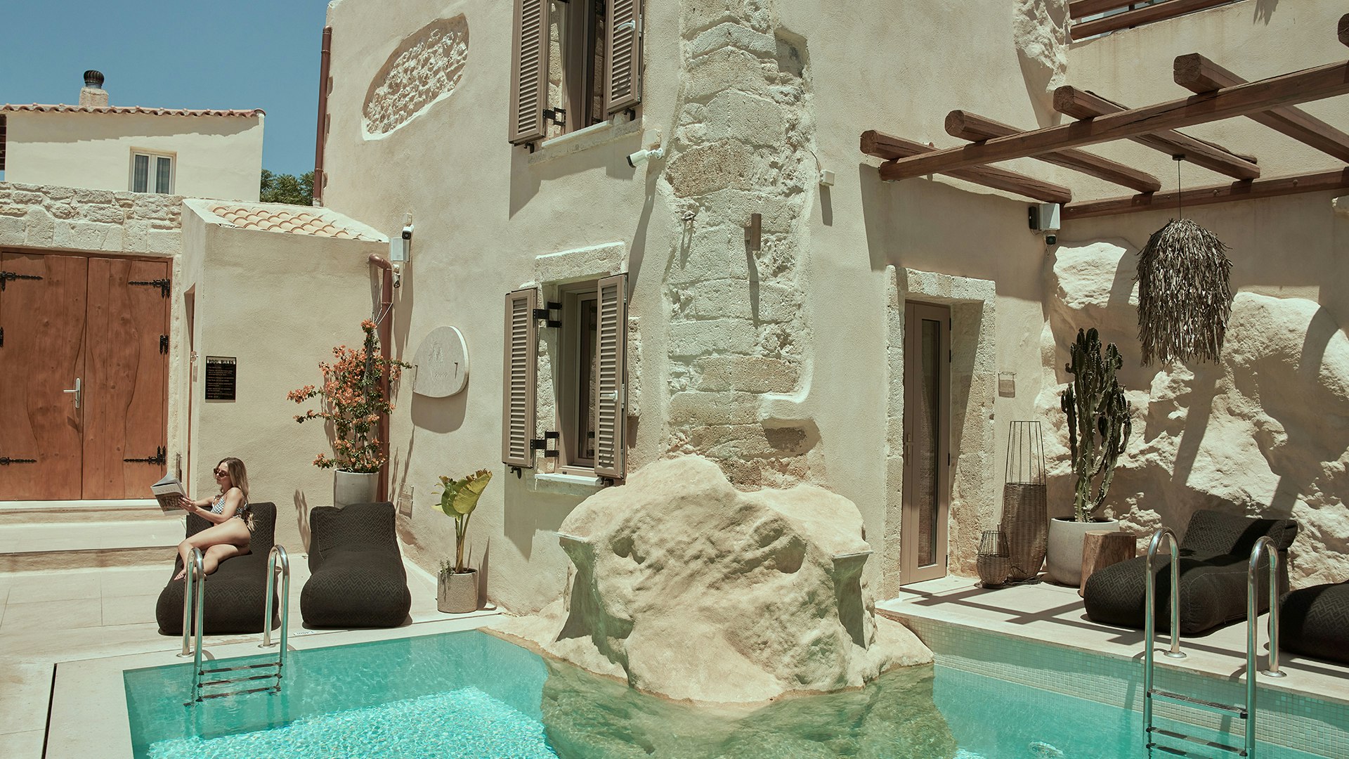 Charming courtyard pool with traditional stone architecture