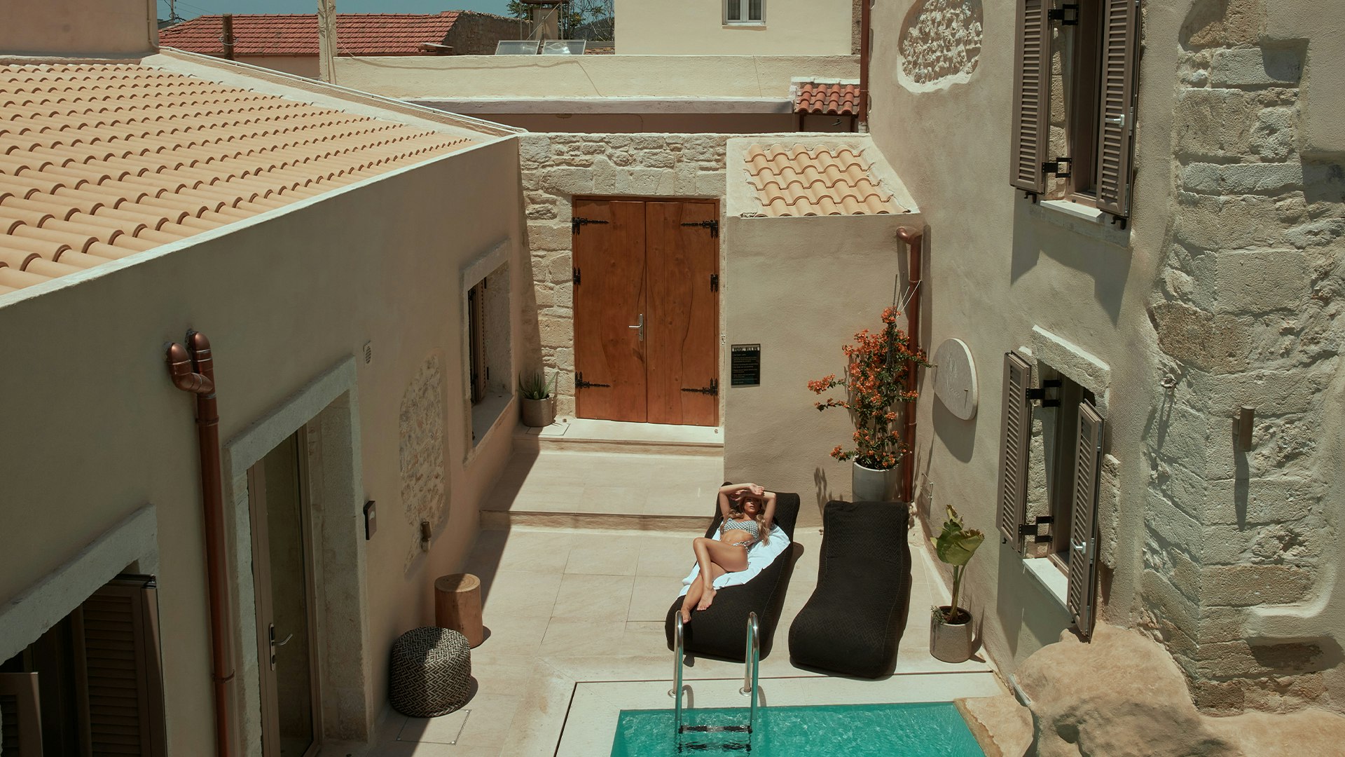Charming courtyard pool with traditional stone architecture
