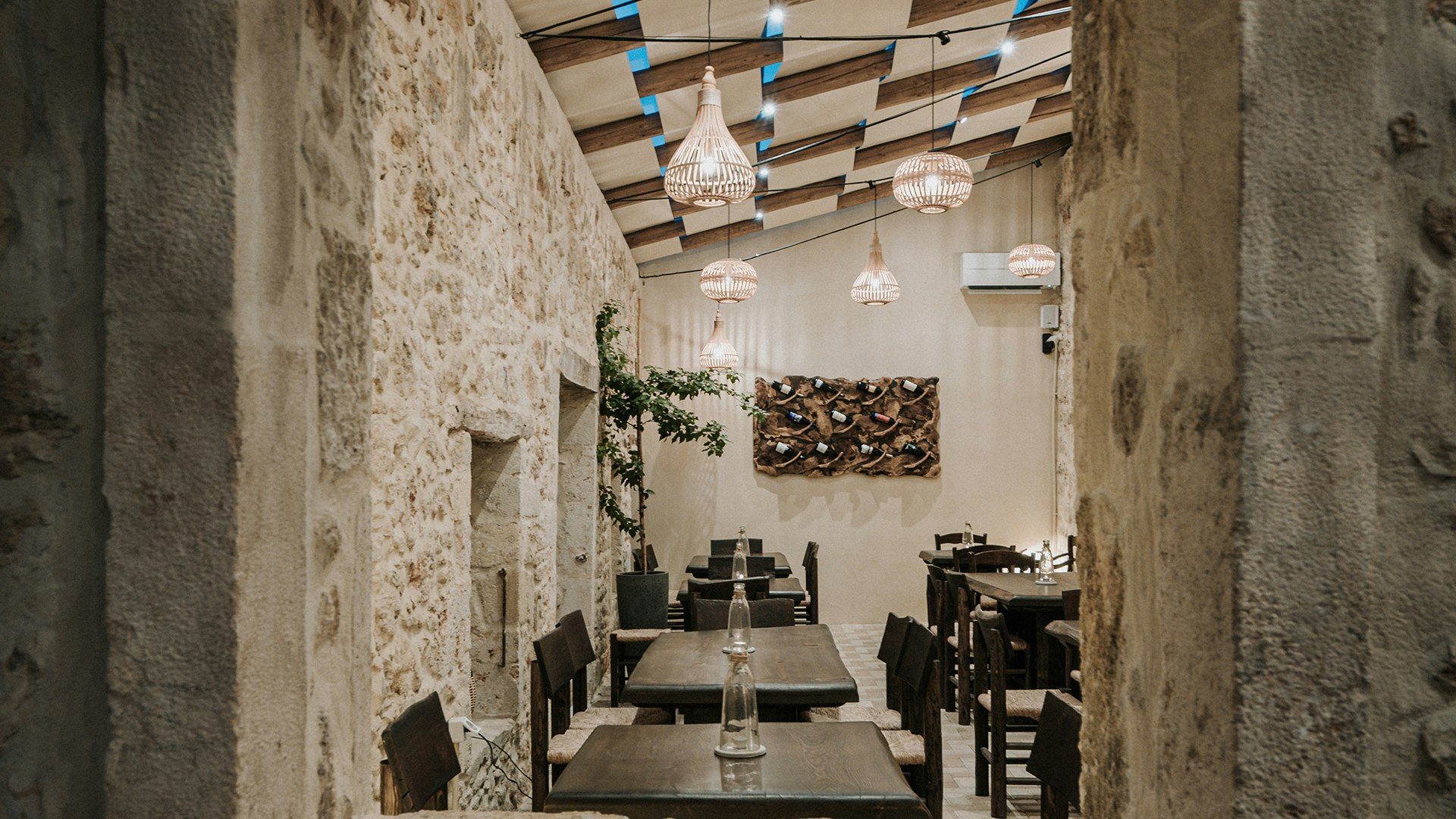 Stone-framed view into Manili Bistro dining area