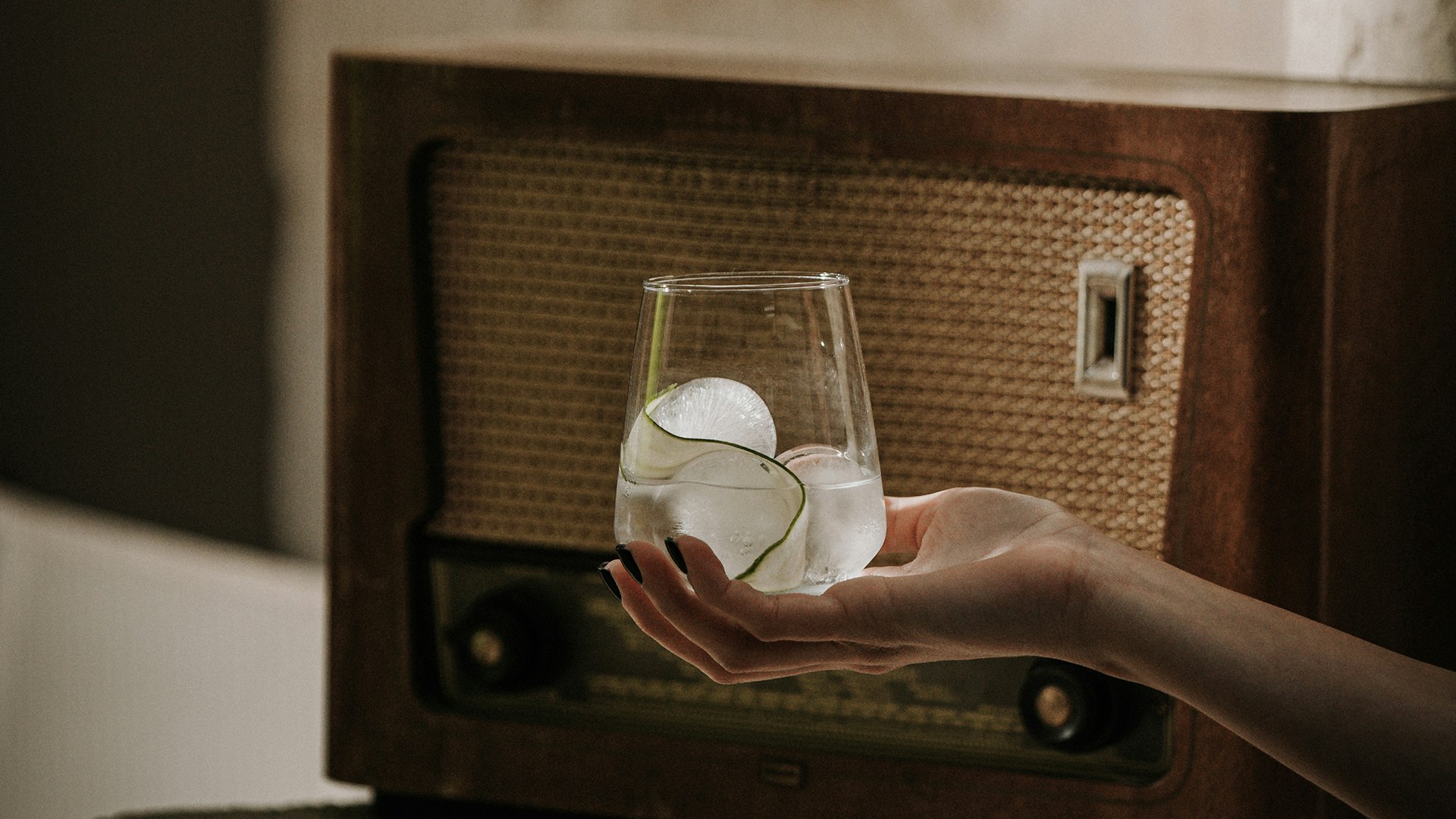 Guest enjoying a drink with vintage charm at Manili Suites