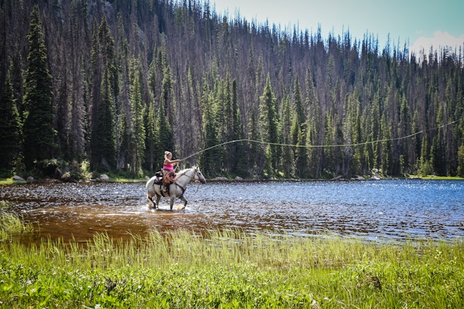 Cierra Fishing on Horseback