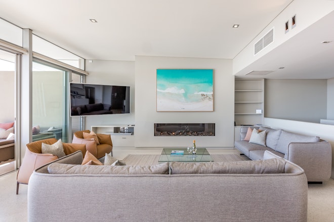 4 Bedroom Premium Beach House - lounge with fireplace