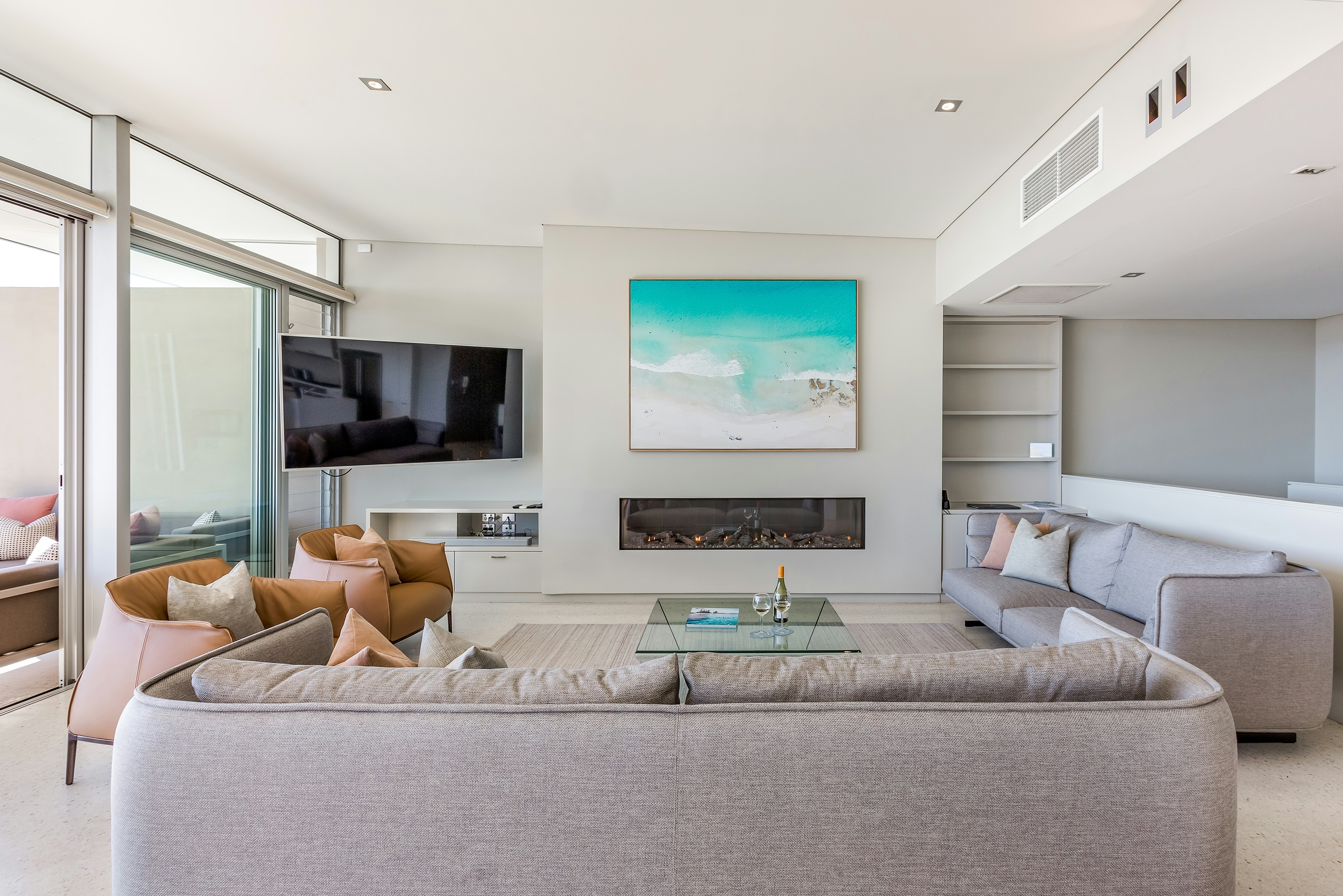 4 Bedroom Premium Beach House - lounge with fireplace