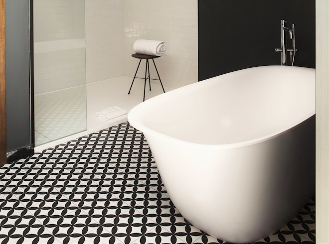 Deluxe Atico bathroom with freestanding bathtub