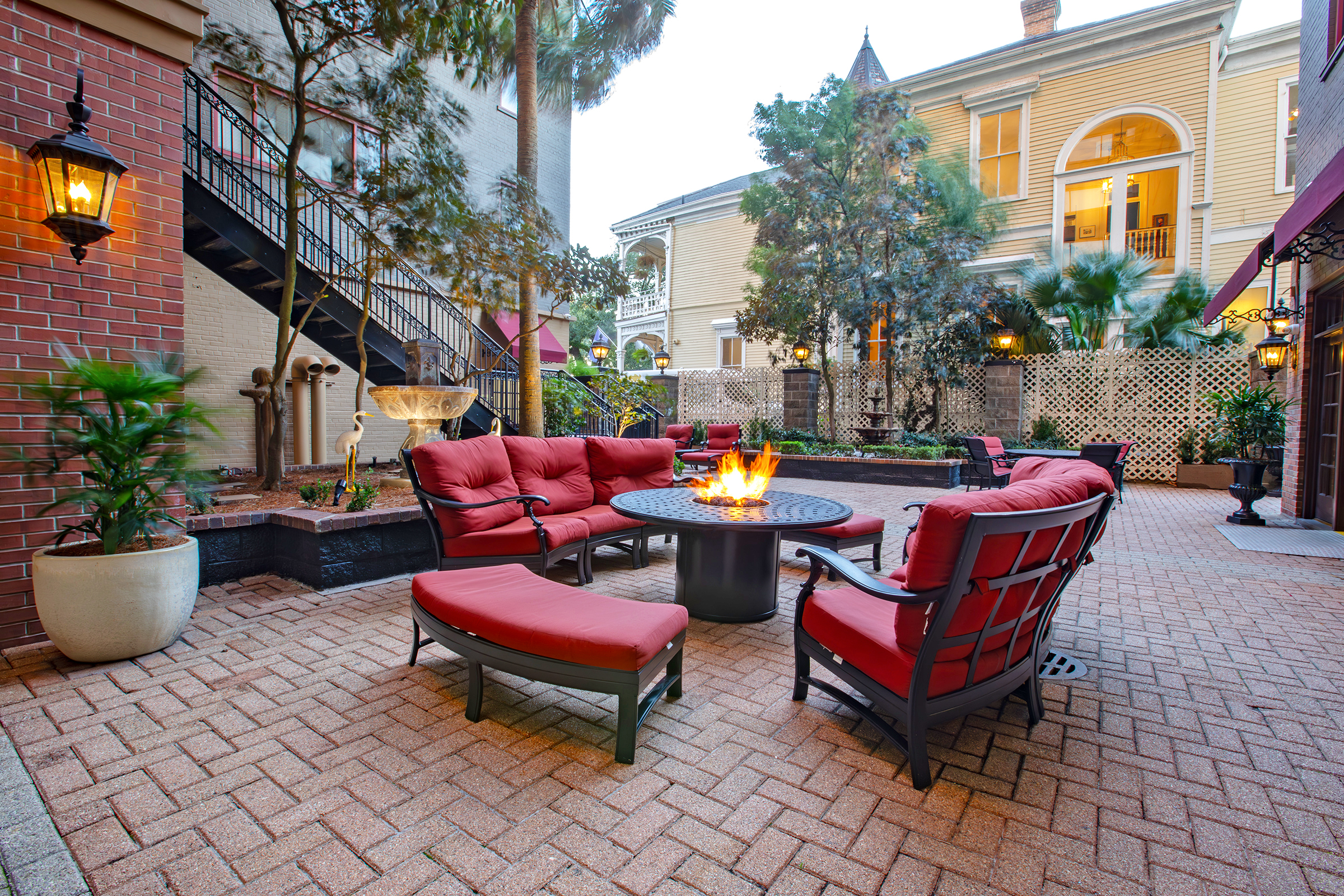 a small outdoor seating area with a fire pit